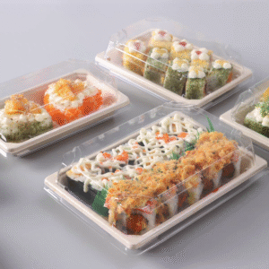 A stack of white biodegradable sushi trays ready for use in a restaurant.